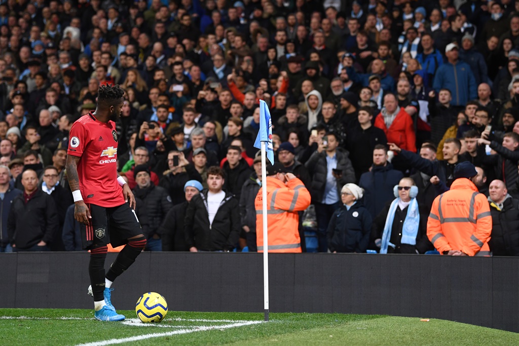  Fred of Manchester United walks to take a corner kick after being hit by objects thrown by the Manchester City fans during the Premier League match between Manchester City and Manchester United at Etihad Stadium on December 07, 2019 in Manchester, United Kingdom. (Photo by Laurence Griffiths/Getty Images)