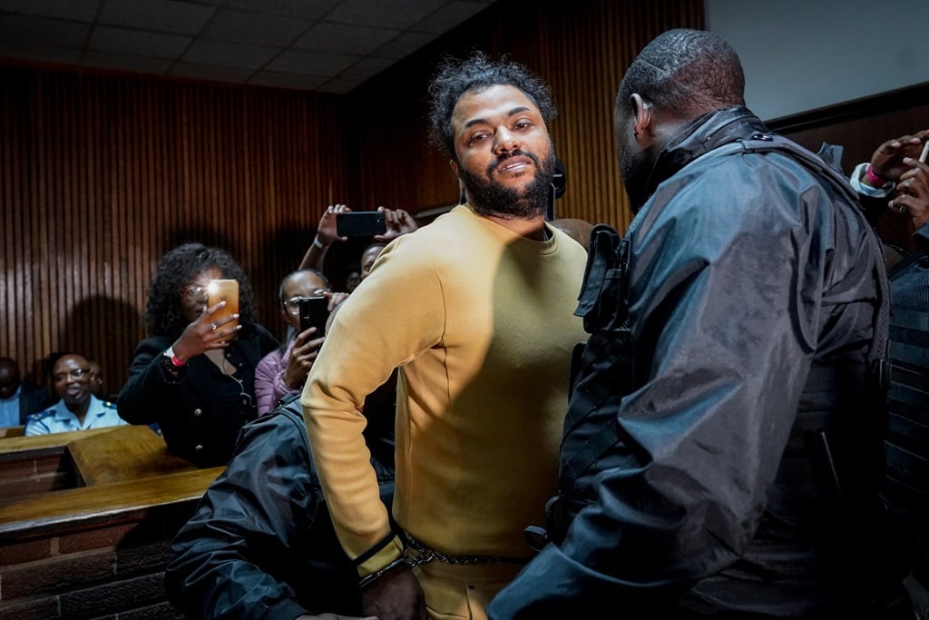 Thabo Bester appears in court in mustard coloured 