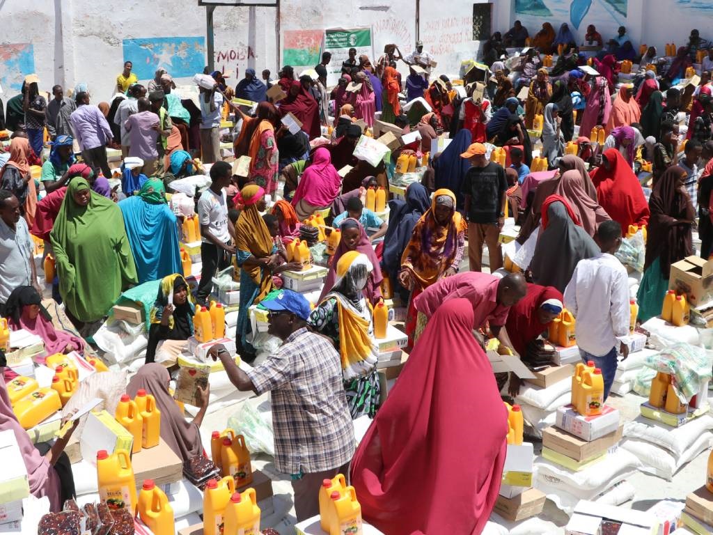 Internally displaced people (IDP) gather in the Shingani District of the Somali capital Mogadidshu to collect food rations being distributed to the families.