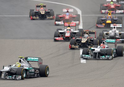 <b>GREAT START, BUT...:</b> Michael Schumacher (right) follows his team mate Nico Rosberg into Turn 1 at the start of the 2012 Chinese F1 GP. The multiple world champ retired on lap 13. 