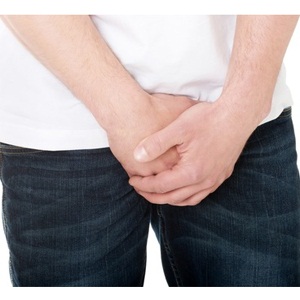 Shy man covering his crotch from Shutterstock