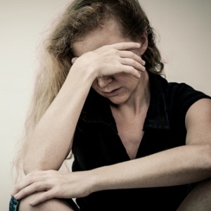 Depressed woman from Shutterstock