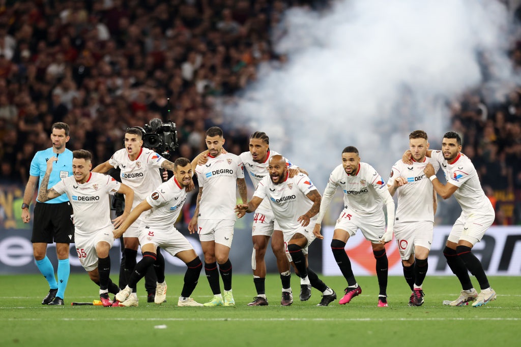 BUDAPEST, HUNGARY - MAY 31: Players of Sevilla FC celebrate after Gonzalo Montiel of Sevilla FC (not pictured) scores the teams fourth penalty in the penalty shoot out during the UEFA Europa League 2022/23 final match between Sevilla FC and AS Roma at Puskas Arena on May 31, 2023 in Budapest, Hungary. (Photo by Maja Hitij/Getty Images)