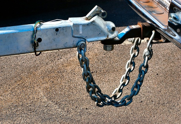 <b>DID YOU KNOW...?</b> Every trailer is required to have a safety chain between it and the tow ball in case of a connection falure. <i>Image: Shutterstock</i>