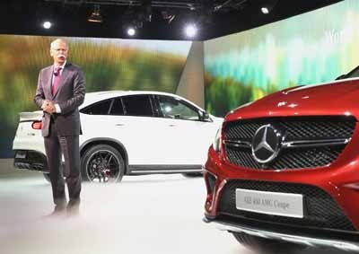 <b>LOOKING GOOD:</b> Mercedes' Dieter Zetsche introduces the GLE 63 Coupe (left)) and GLE 450 AMG Coupe in Detroit.. The auto show will open to the public from January 17-25. <i>Image: AFP / Scott Olsen</i>