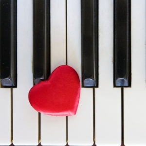 Red heart on piano from Shutterstock