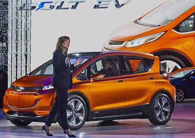 <b>BUYERS TURNING OFF TO ELECTRIC?</b> General Motors CEO Mary Barra presents the Bolt electric concept vehicle at the 2015 Detroit auto show - but has cheap fuel turned off buyers?  <i>Image: AP / Tony Ding</i>