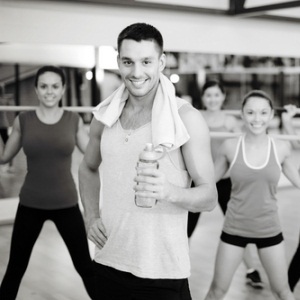 Gym trainer with class from Shutterstock