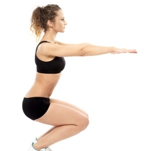 Woman doing squats from Shutterstock