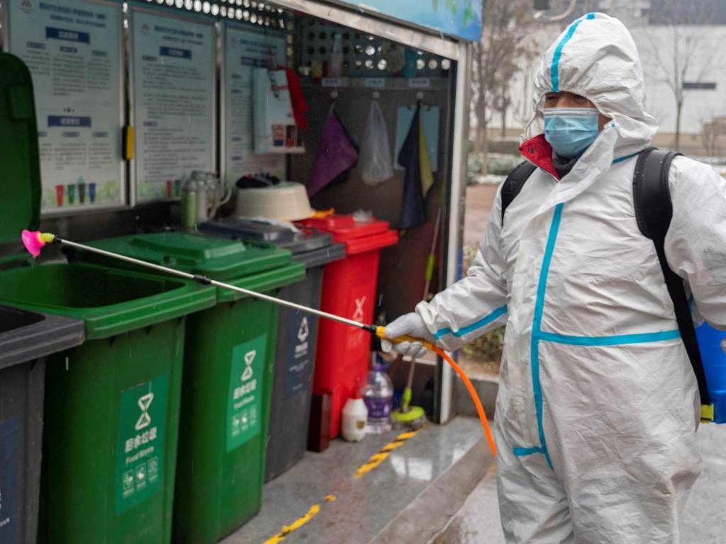 This photo shows a staff member spraying disinfect