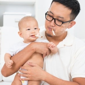 Chinese father and son smoking from Shutterstock