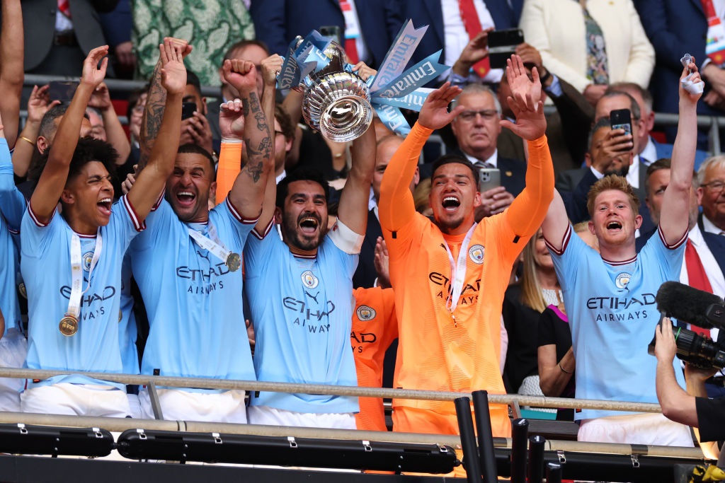 LONDON, ENGLAND - JUNE 3: Manchester Citys Ilkay Gundogan lifts the trophy after winning the Emirates FA Cup Final match between Manchester City and Manchester United at Wembley Stadium on June 3, 2023 in London, England. (Photo by Marc Atkins/Getty Images)