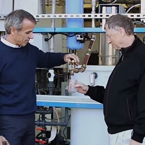 Bill Gates drinks water from the Omniprocessor. 