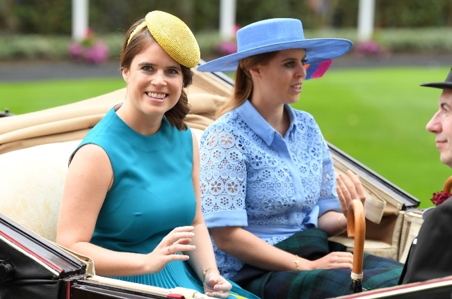 Princesses Eugenie and Beatrice (pictured at Ascot in 2019) have been linked to their father Prince Andrew's latest scandal involving a fraudulent businessman and a Turkish millionaire. (PHOTO: Gallo Images/Getty Images)