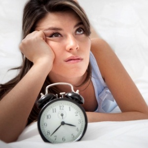 Woman unable to sleep from Shutterstock