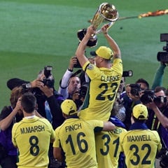 Australia's captain Michael Clarke (top C) lifts the winning trophy of 2015 Cricket World Cup during a victory lap after his team beat New Zealand in the final in Melbourne. (AFP)