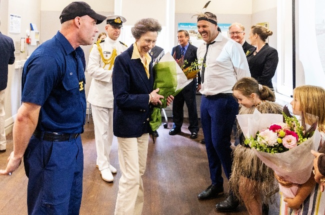 The Princess Royal receives flowers during a visit