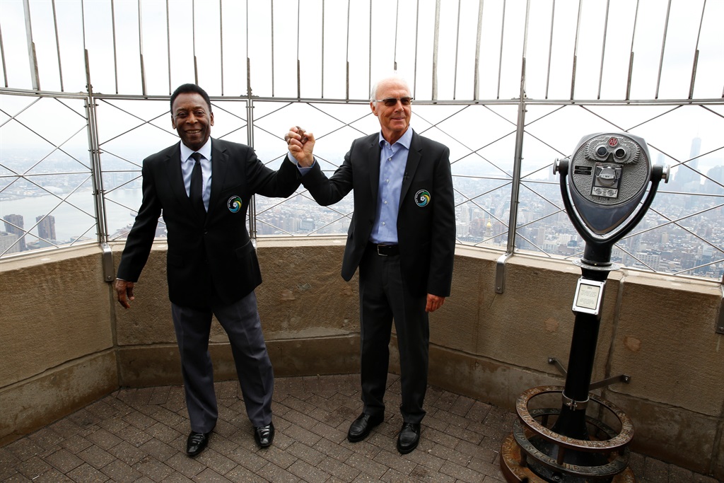  A file photograph of former New York Cosmos players Pele and Franz Beckenbauer posing for photos at The Empire State Building in New York, US, on 17 April 2015. Pele passed away in December 2022, while Beckenbauer followed on 7 January