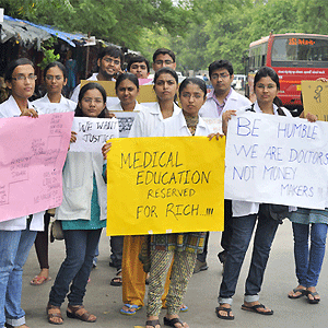 Ironic: Medical students on strike, protesting against an exorbitant fee increase of 100% by the state municipality run medical school on September 02, 2012 in Ahmedabad, India. Shutterstock.