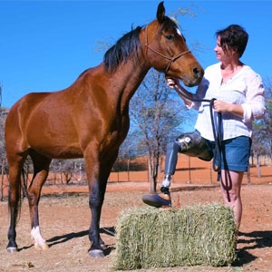 Maretha Coetzee with her horse on her farm in Namibia. Photo by William Welfare