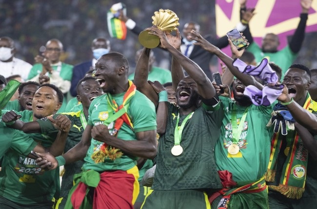 Senegal's captain Kalidou Koulibaly lifts the Afcon trophy that the Lions of Teranga won in 2022 in Cameroon against Egypt. 
(Photo by Visionhaus/Getty Images)