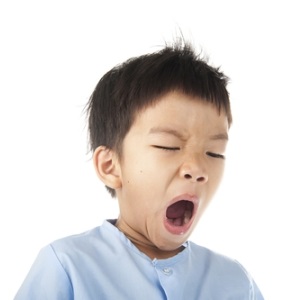 Yawning boy from Shutterstock