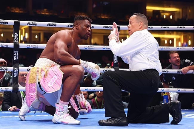 Francis Ngannou is counted down by referee Ricky Gonzalez after being knocked down by Anthony Joshua during their heavyweight fight at the Kingdom Arena in Riyadh, Saudi Arabia on 8 March 2024. (Richard Pelham/Getty Images)