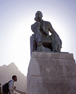 Students walk past a statue of British colonialist Cecil John Rhodes at the University of Cape Town near the city center of Cape Town, South Africa on 7 March 2015. (Schalk van Zuydam, AP)