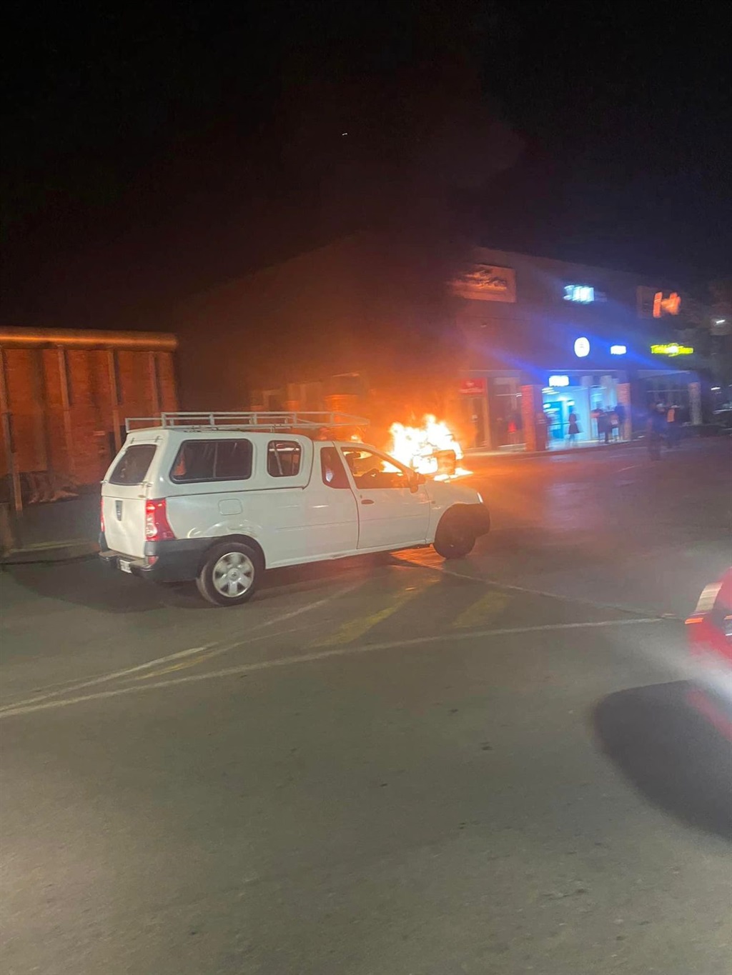The fight between taxi drivers and e-hailing drivers continues. This after another vehicle was torched on Monday night in Protea Glen Mall. Photo: Supplied.