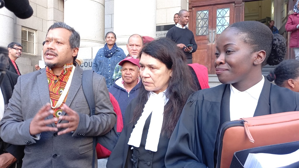 Tauriq Jenkins, with advocates Roseline Nyman (centre) and Ntwanano Mashava. 