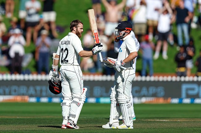Kane Williamson of New Zealand celebrates his double century while Henry Nicholls. (Photo by Hagen Hopkins/Getty Images)