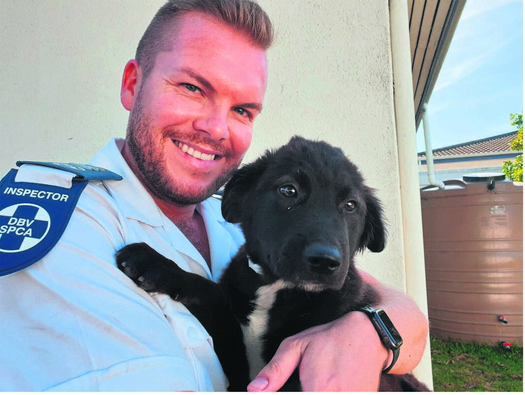 Chief Inspector Jaco Pieterse with the rescued puppy called Walter. PHOTO: spca