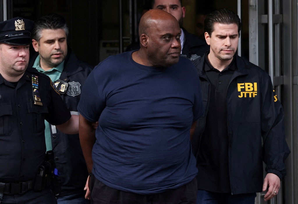 Frank James, the suspect in the Brooklyn subway shooting walks outside a police precinct in New York City, New York, U.S., April 13, 2022. REUTERS/Andrew Kelly