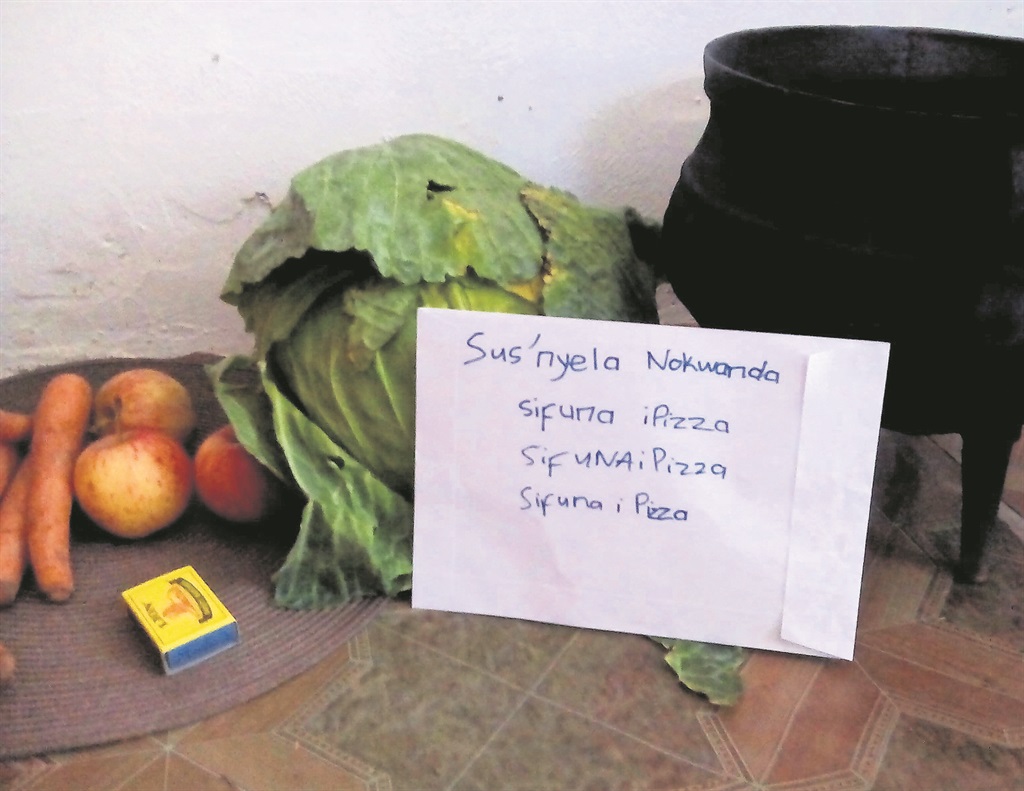 Nokwanda Gotywa claims her ancestors rejected her offering and instead left this note.                                                               Photo by Unathi Machumane  