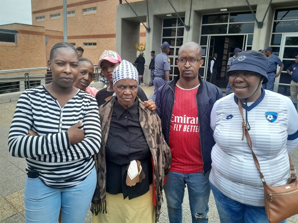 Zodwa Nkosi (second from left, front) comforted by residents. Photo by Happy Mnguni