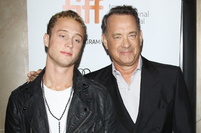 Chet, with father Tom Hanks, says having  famous parents meant people judged him before they got to know him. (PHOTO: Getty Images) 