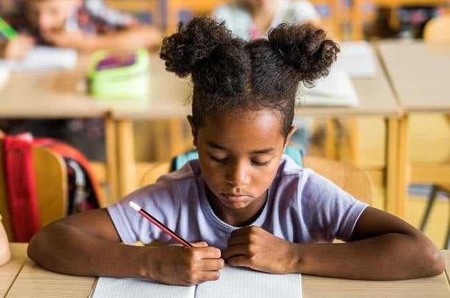 "In class, a child with APD might have difficulty following instructions, maintaining attention and will probably rely on assistance and repetition more than their peers". (Getty Images) 