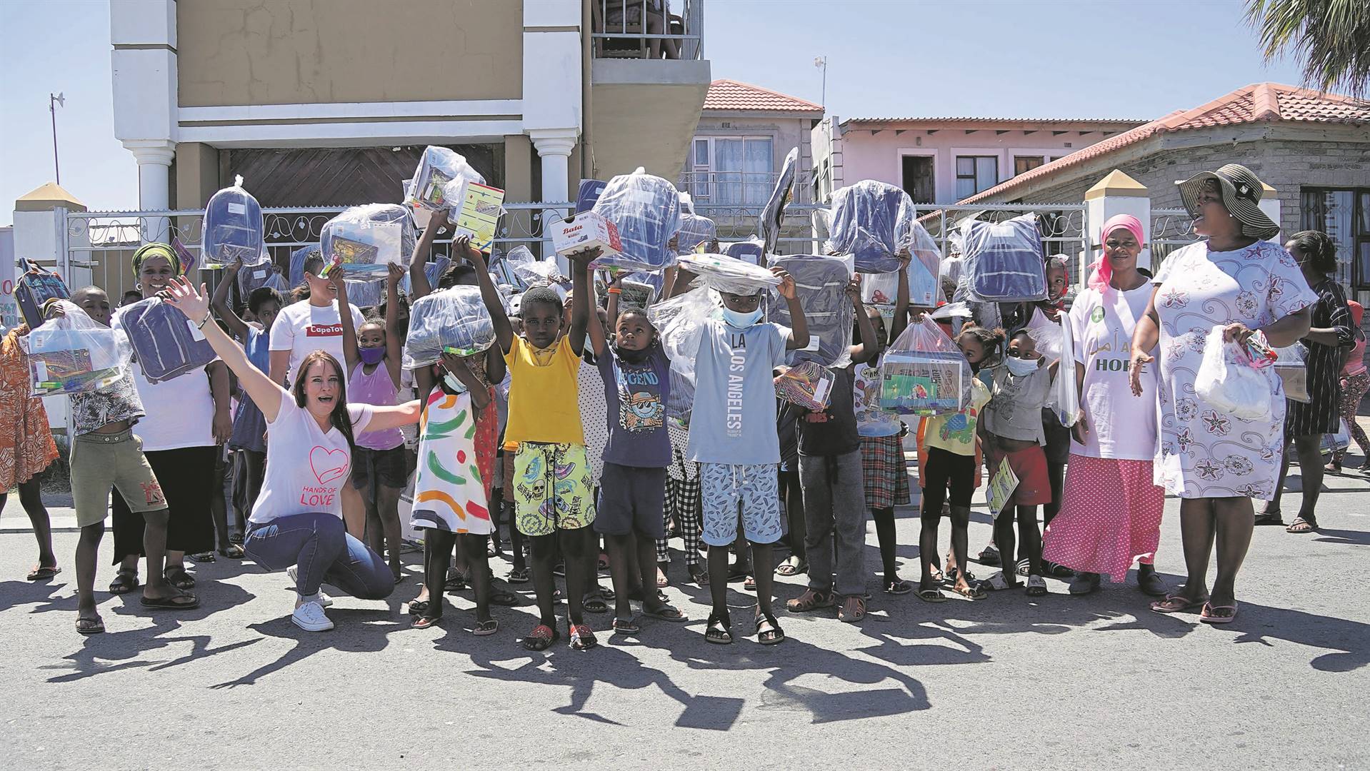 School bags were distributed in Tambo Village near Manenberg on Saturday 22 January.PHOTO: Supplied