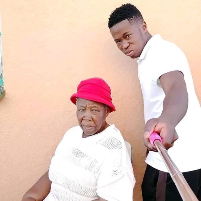 Paballo poses for a selfie with his grand mother, 