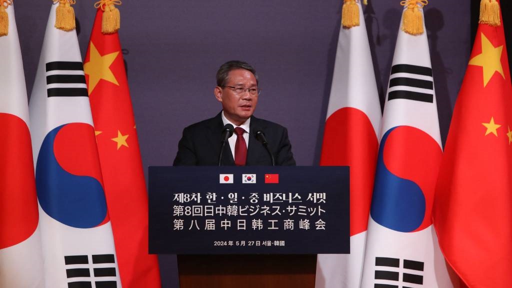 Chinese Premier Li Qiang speaks during a business summit with Japanese Prime Minister Fumio Kishida and South Korean President Yoon Suk Yeol at Korea Chamber of Commerce and Industry in Seoul. (Chung Sung-Jun/Pool/AFP)