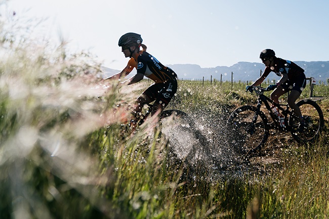 Overall leader Sina Frei ahead of African riders jersey leader Candice Lill, during stage 1 of the 2021 Absa Cape Epic Mountain Bike stage race on Monday. (Photo: Simon Pocock/Absa Cape Epic)