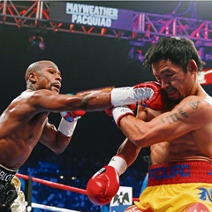 Manny Pacquiao (right) caught by Floyd Mayweather Jr's right hook during their world welterweight title fight in Las Vegas last Sunday. Picture: AP Photo/John Locher
