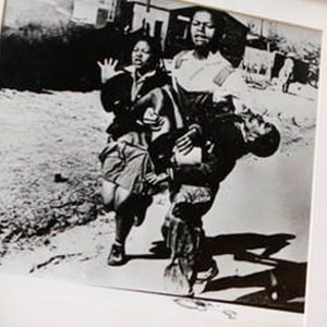 The iconic photo showing 13-year-old Hector Pieterson being carried after being shot by police during the 1976 Soweto uprising. (File, AP)