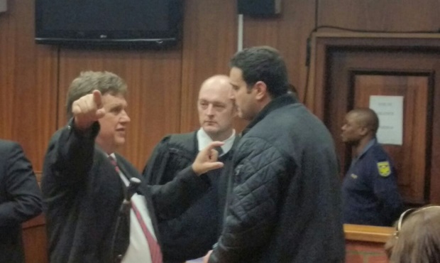 Panayiotou chatting to Price and attorney
Theuns Roelofse.


