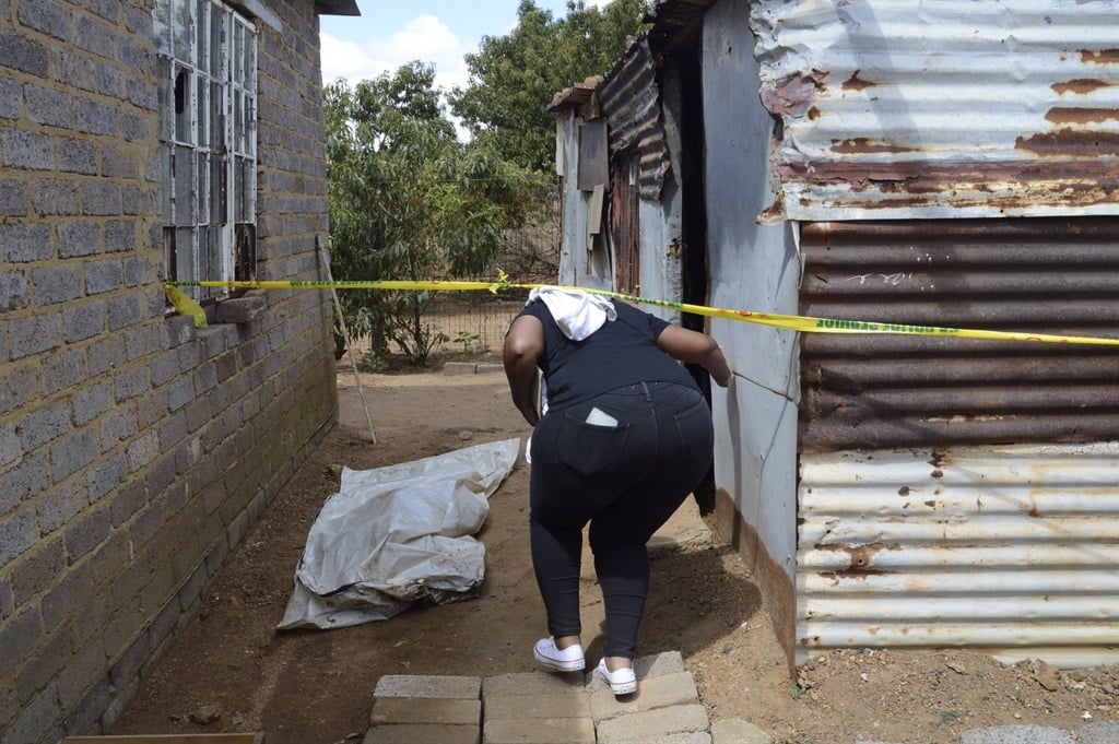 Former soccer star Bennett Chenene's sister Nomvula Chenene, who went missing on 10 December, was found buried in a shallow grave inside a shack at Lakeside in Orange Farm. Photo by Tumelo Mofokeng