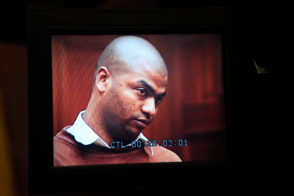Thabo Bester, dubbed the 'Facebook Rapist' for his crimes, seen on a screen in the Western Cape High Court on 2 May 2012.