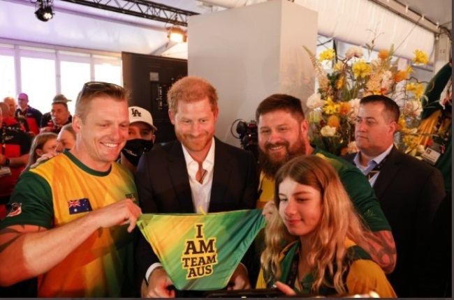 A rather sheepish Prince Harry poses with a Speedo gifted to him by Team Australia at the Invictus Game in The Hague, Netherlands. (PHOTO: Twitter/aussieinvictus)