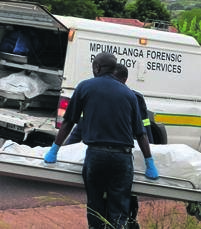 Pathologists remove bodies of the murder victims, two pensioners aged 64 and 83.          Photo by Oris Mnisi 