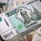 Rouble plunges 30%, rand weaker as West bolsters Russia sanctions
