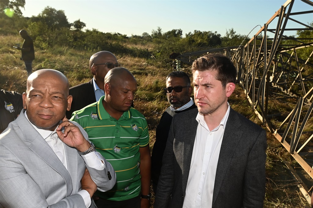 Mayor Of Tshwane, Cllr Cilliers Brink and Minister Of Electricity, Dr Kgosientsho Ramokgopa, visit the scene where seven high voltage power pylons wires fell on April 11, 2023 in Pretoria. South Africa. It is reported that seven high voltage power pylons fell on Sunday, and it may take up to five days to fully erect new power pylons.